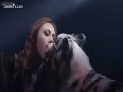A clip from a music film featuring attractive women and dogs